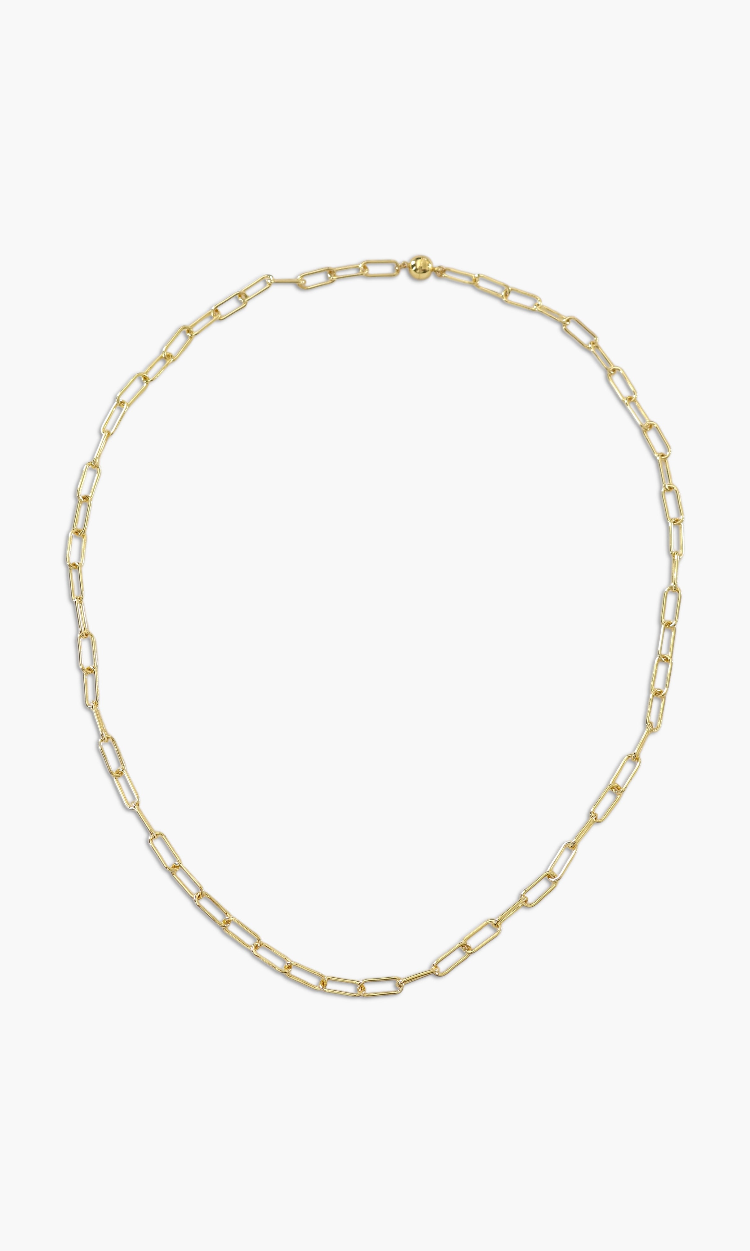 A person wearing multiple necklaces with amethyst stones and gold accents. The necklaces are part of a stack, and the person is holding some of the necklaces, showcasing the jewelry.