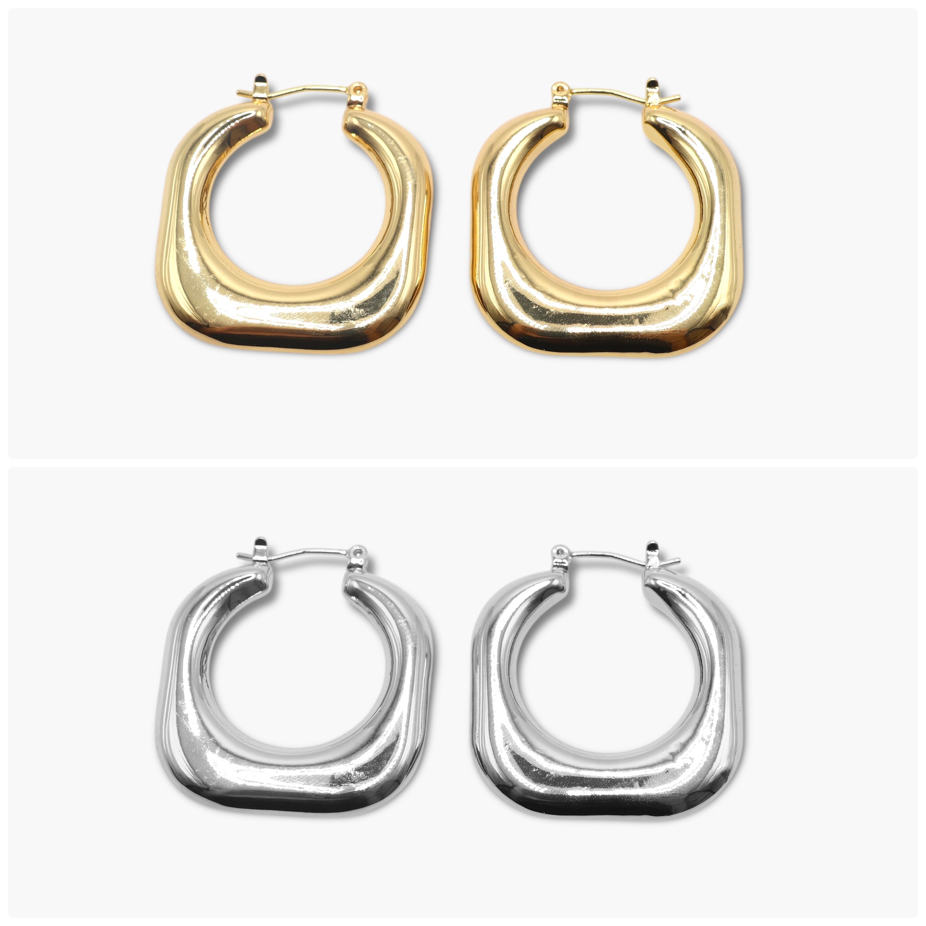 A pair of round hoop earrings, one with a gold plating and the other with a silver finish.