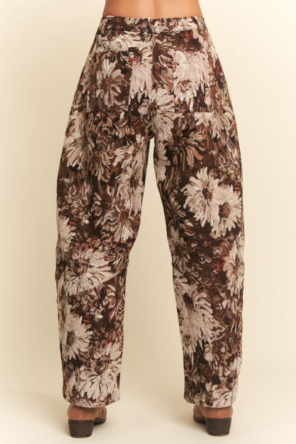 Floral patterned pants on a beige background