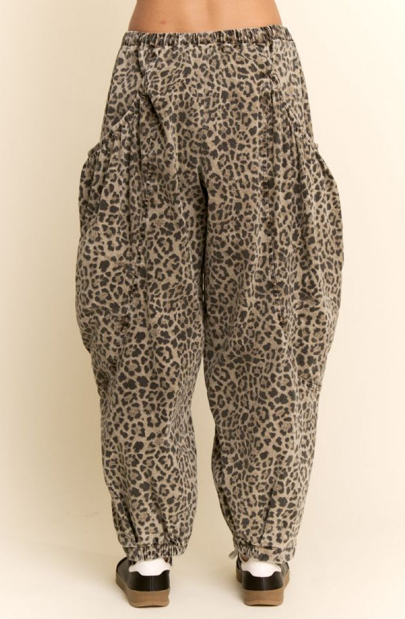Leopard print pants on a beige background