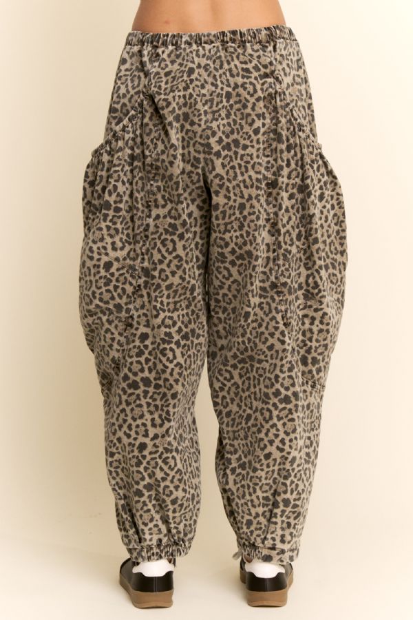Leopard print pants on a beige background