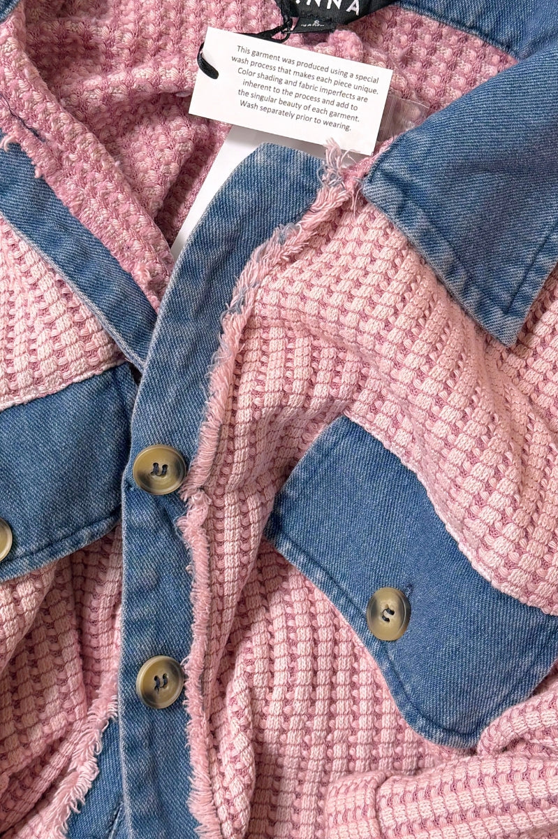 Women’s waffle knit button front romper with collared neckline, utility pockets, rolled short sleeves, and relaxed fit casual one-piece outfit for boutique fashion.