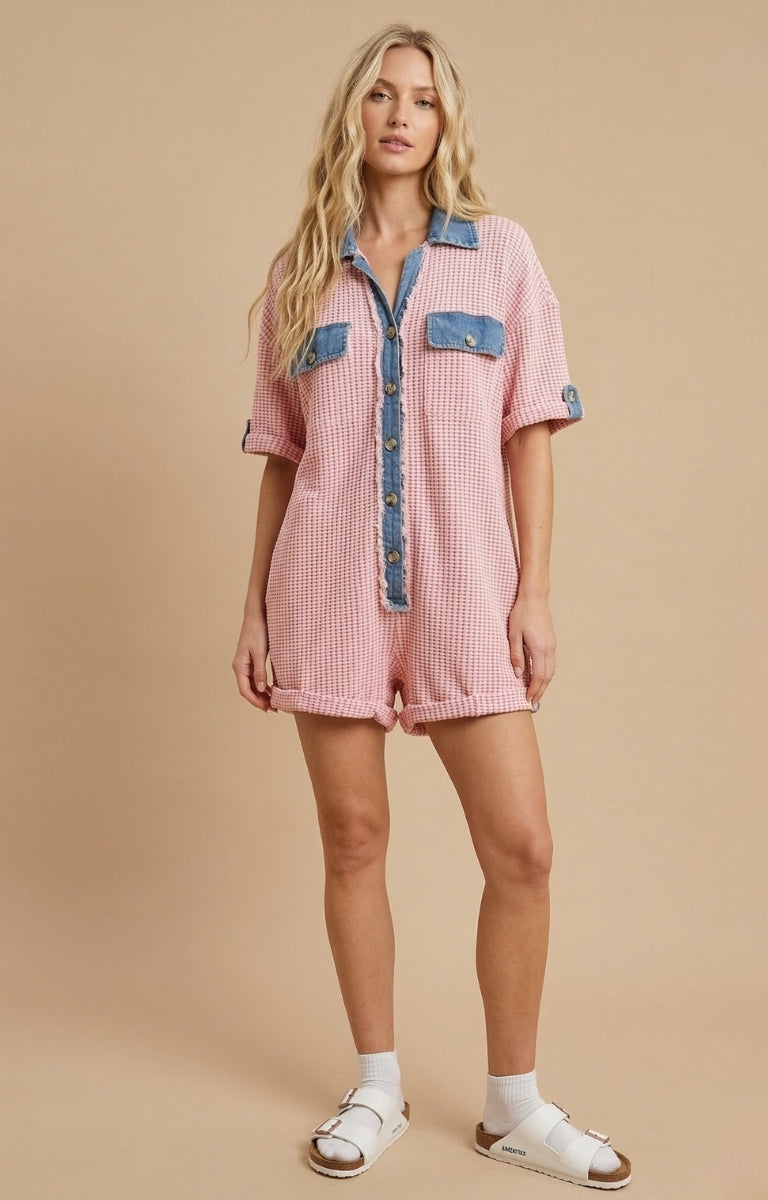 Women’s waffle knit button front romper with collared neckline, utility pockets, rolled short sleeves, and relaxed fit casual one-piece outfit for boutique fashion.