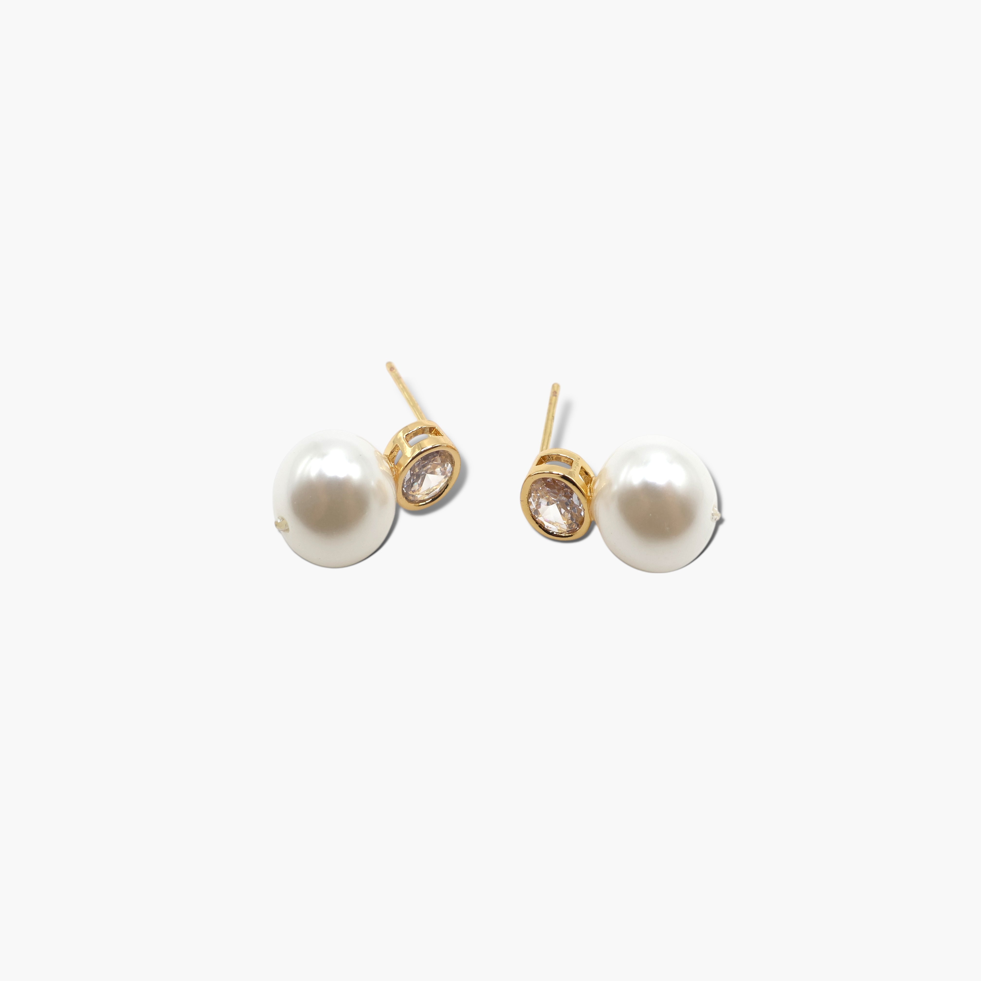 A pair of pearl post earrings with cubic zirconia accents.