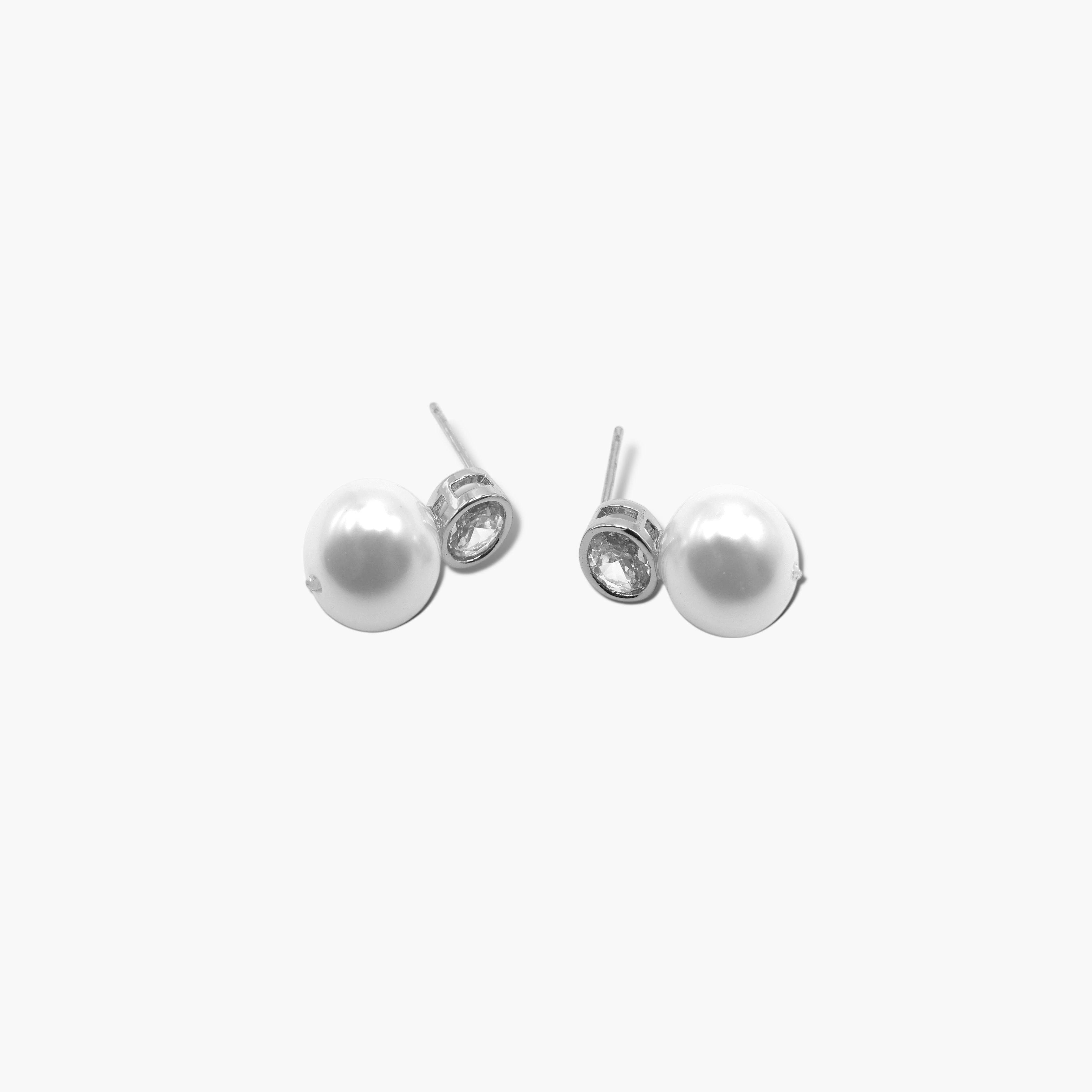 A pair of pearl post earrings with cubic zirconia accents.