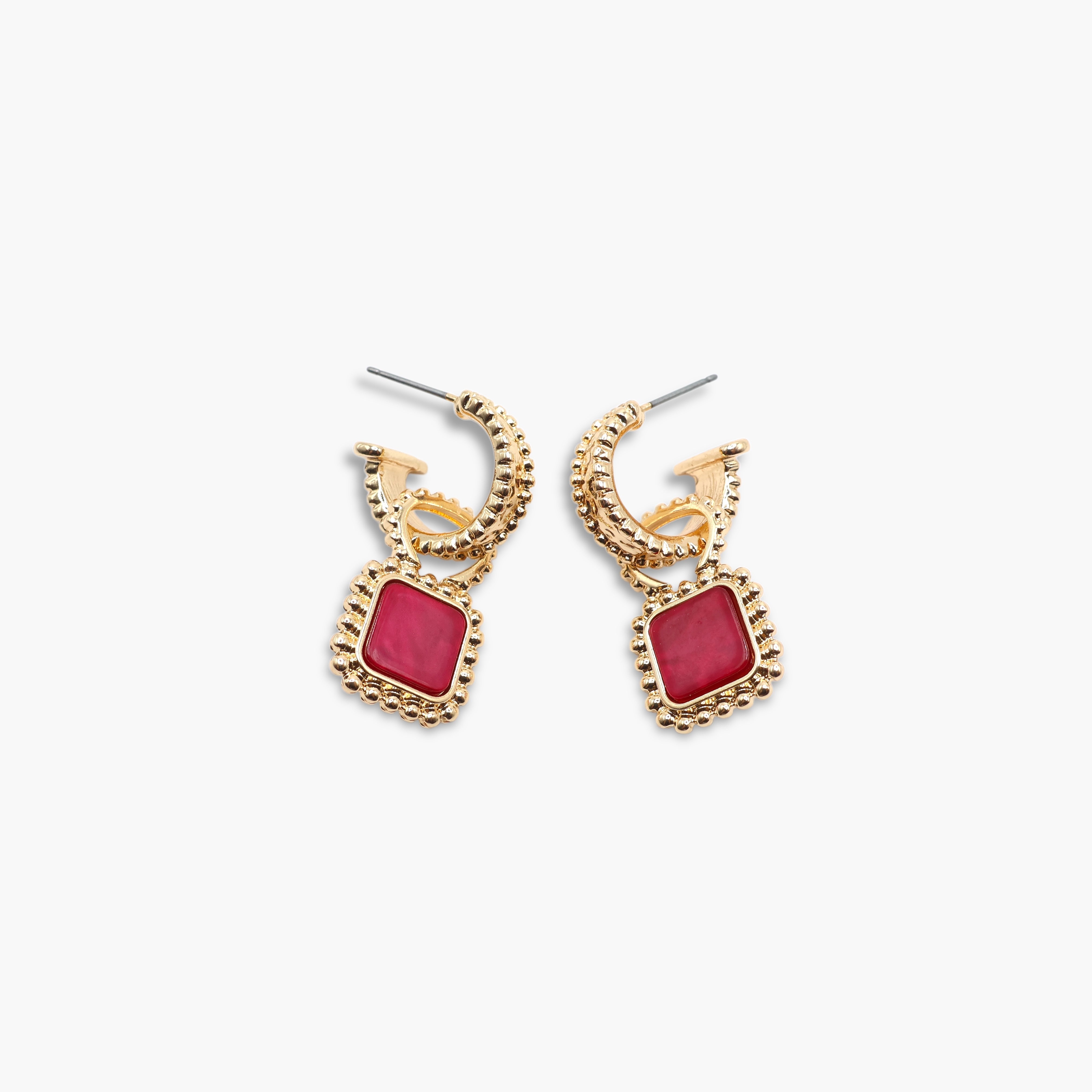A pair of gold-colored hoop earrings with square-shaped gemstones attached to the hoops.