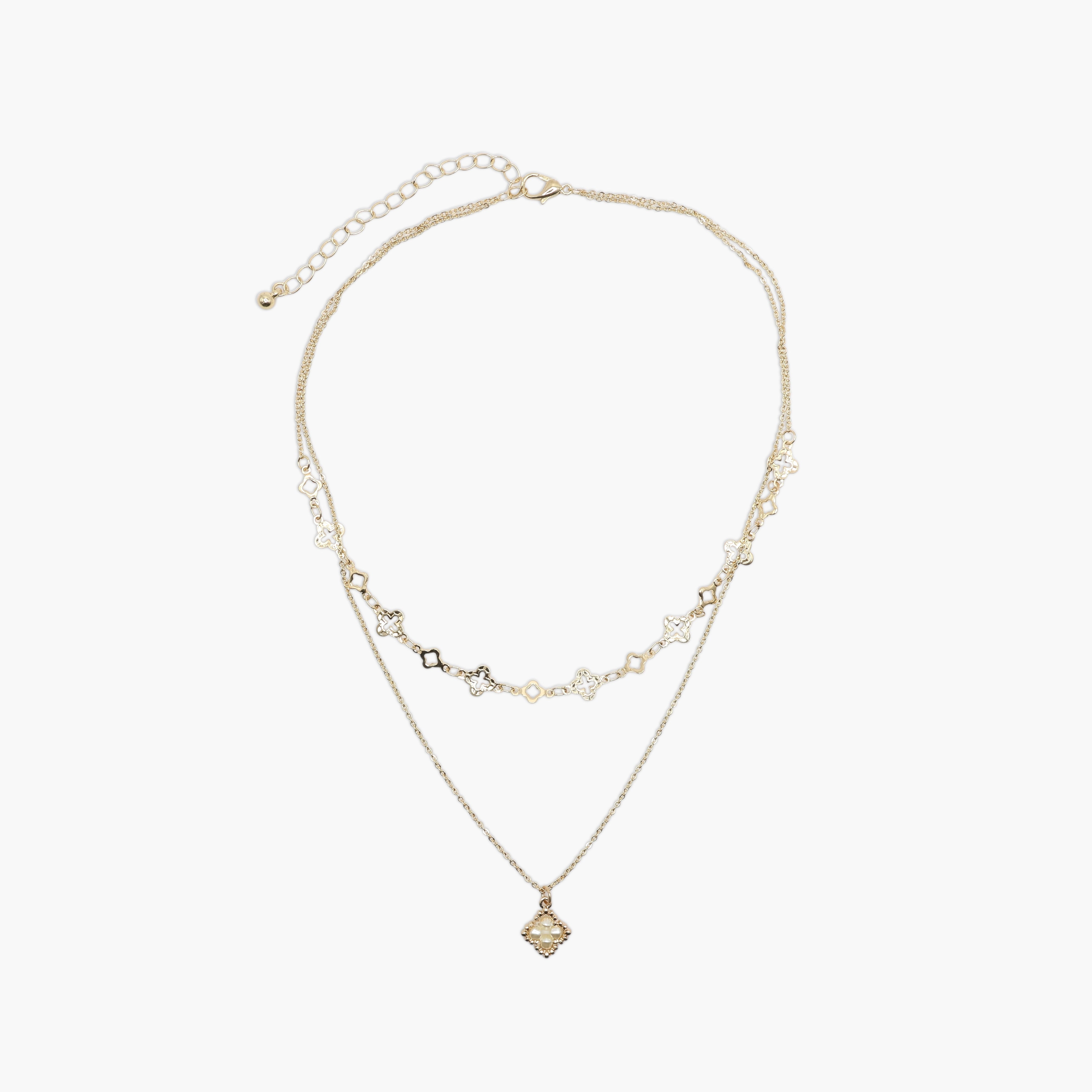 A gold necklace on a white background