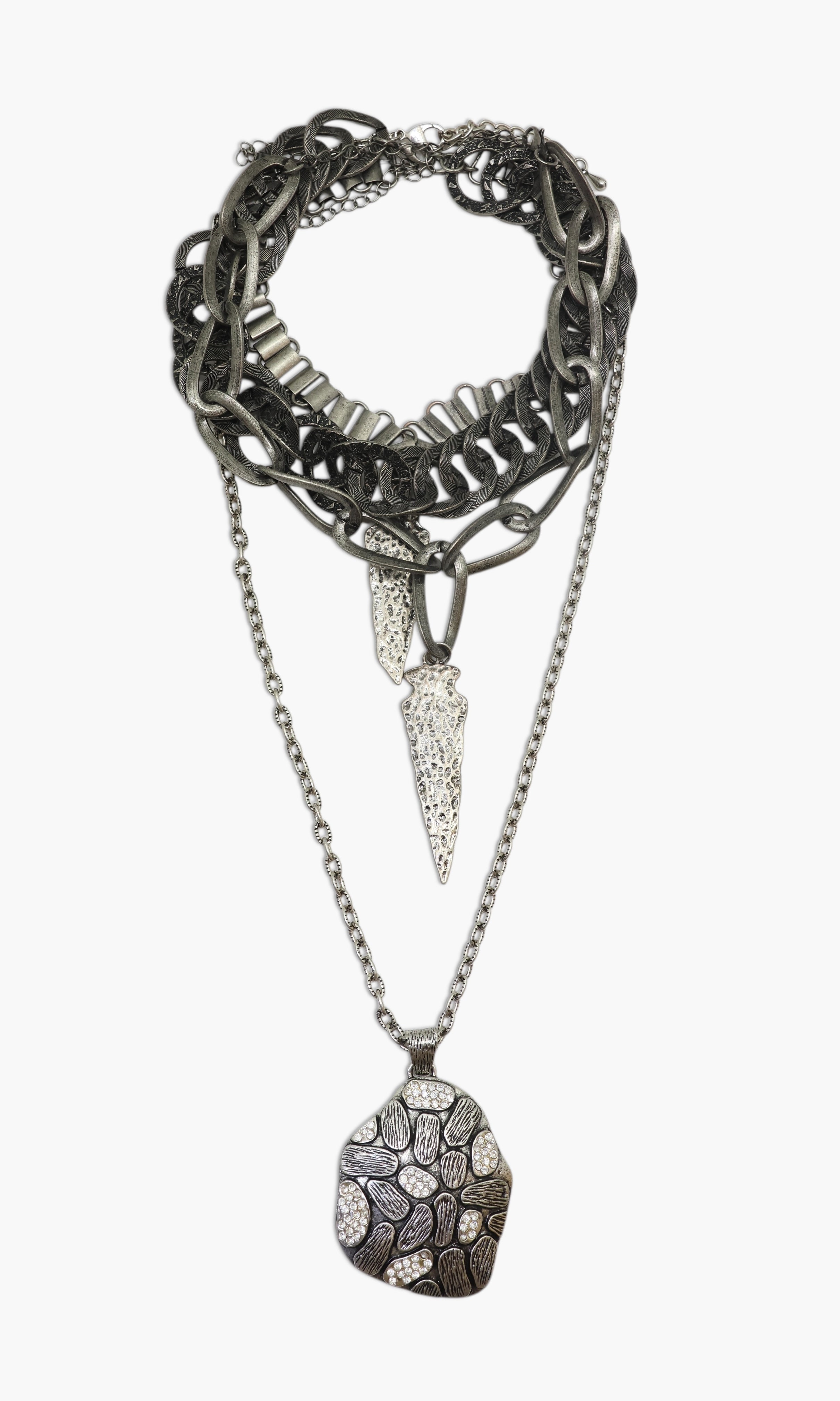 A gunmetal necklace with double arrow design and multiple layers, featuring a large pendant.