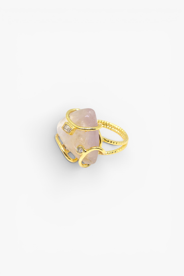 Natural stone statement ring with crystal accents in a gold-tone setting featuring an organic gemstone centerpiece.