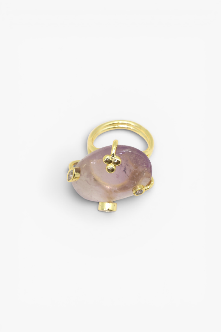Natural stone statement ring with crystal accents in a gold-tone setting featuring an organic gemstone centerpiece.