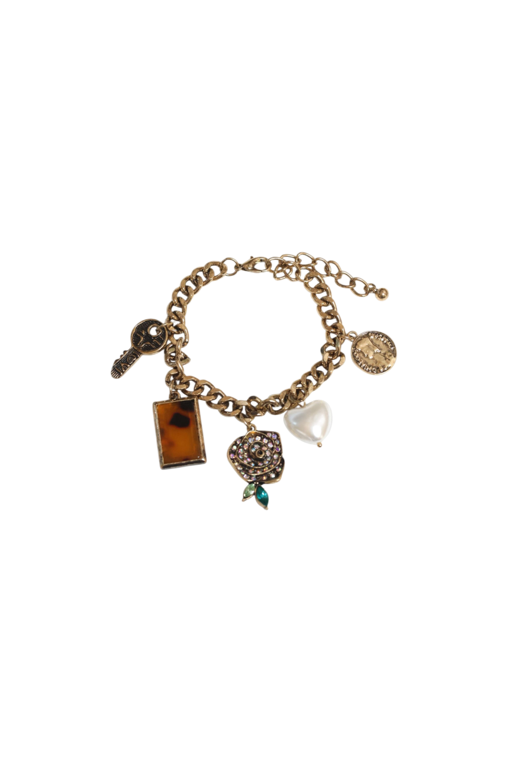 Gold charm bracelet with various charms on a white background