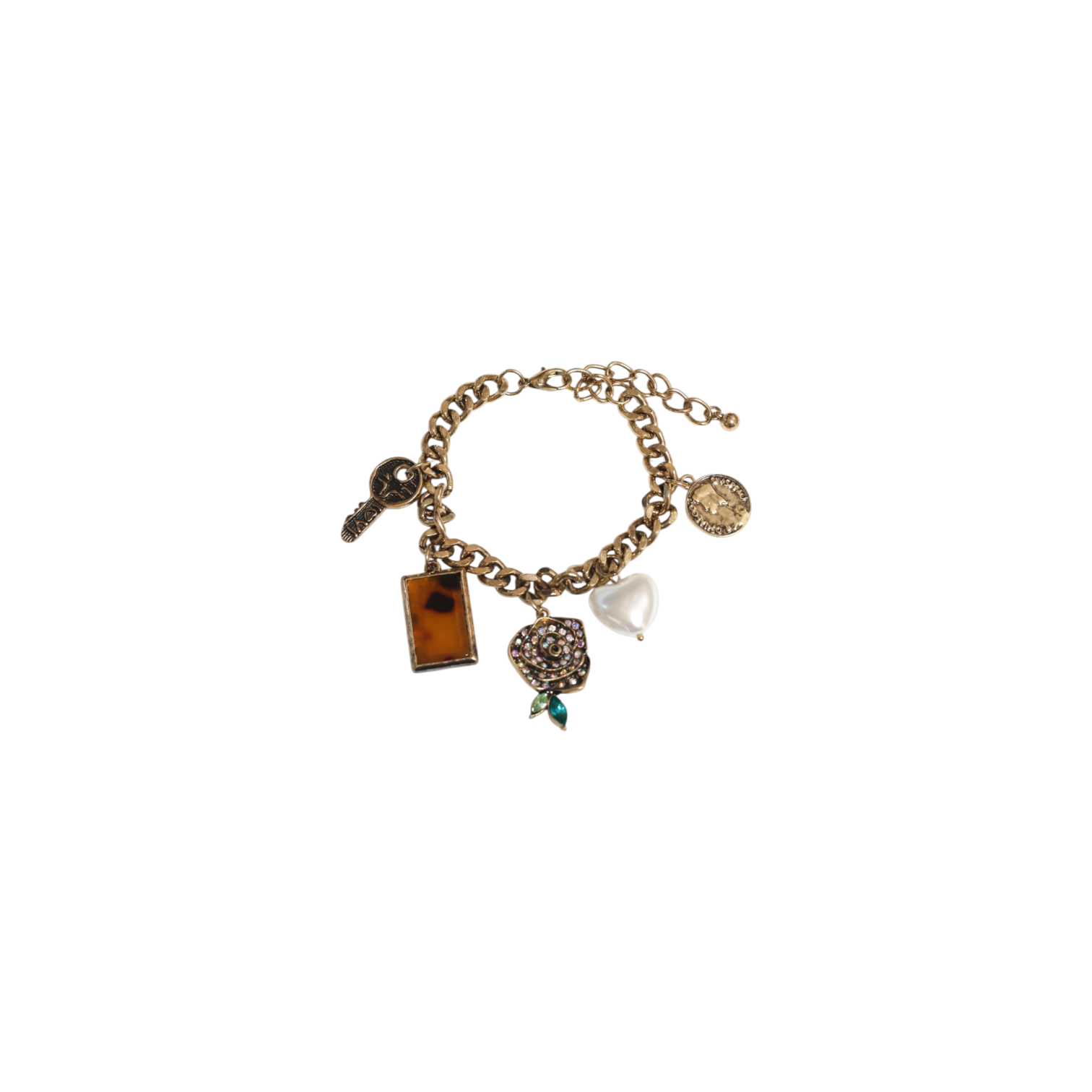 Gold charm bracelet with various charms on a white background