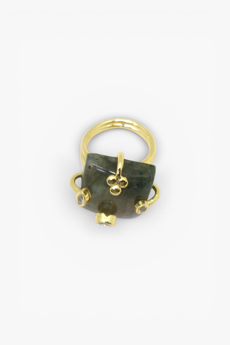 Natural stone statement ring with crystal accents in a gold-tone setting featuring an organic gemstone design.