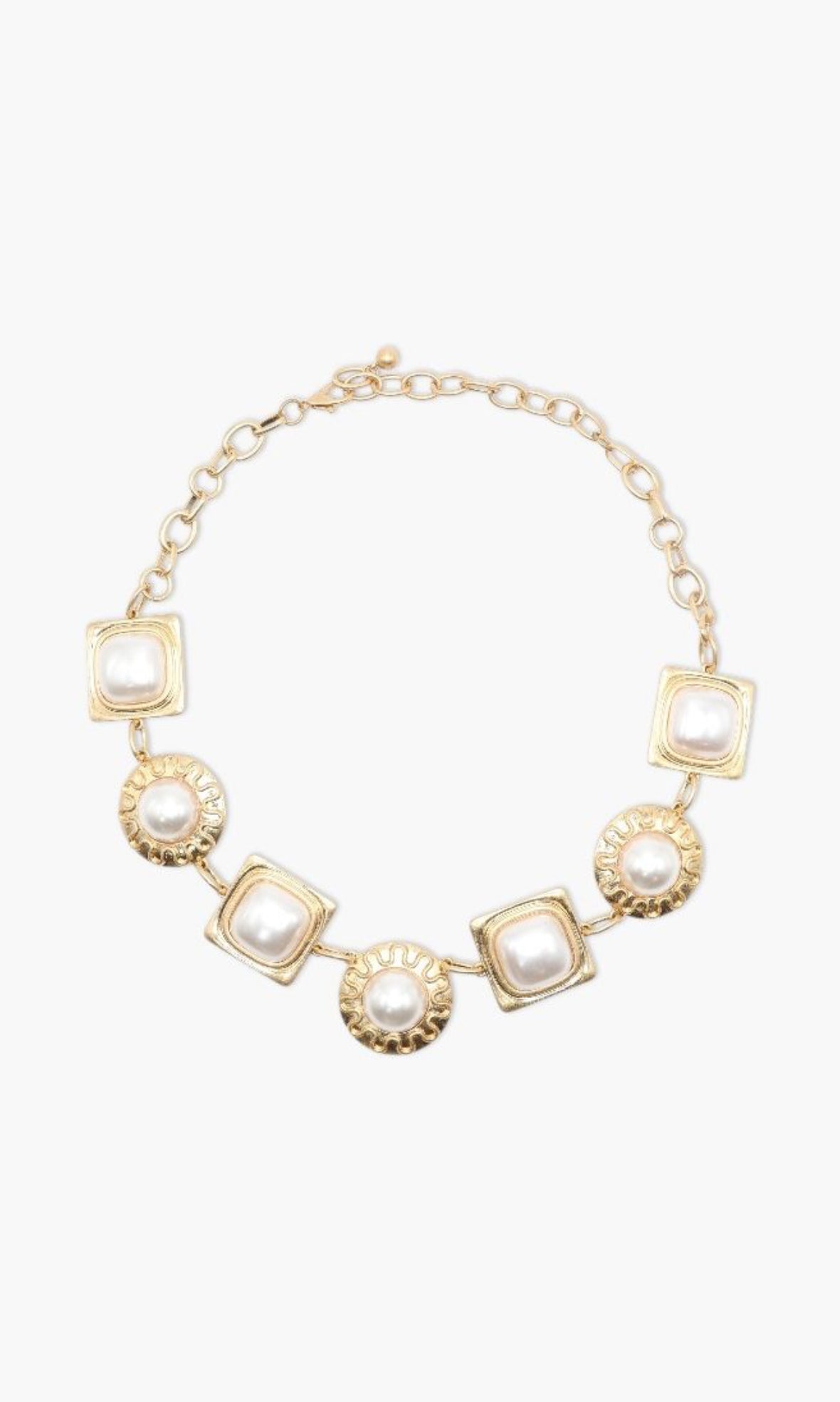 Gold necklace with square and round pendants on a white background