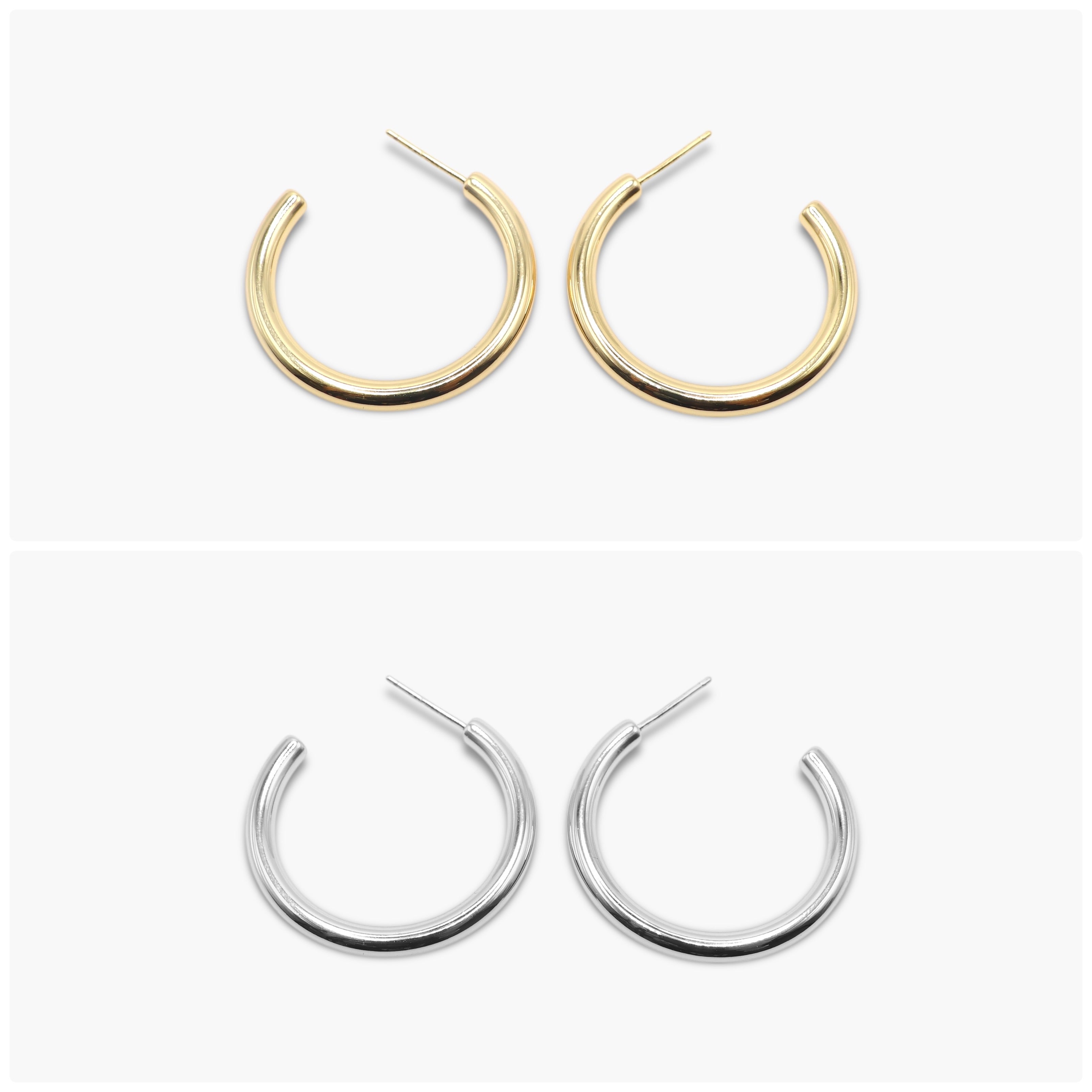A pair of hoop earrings on a white background