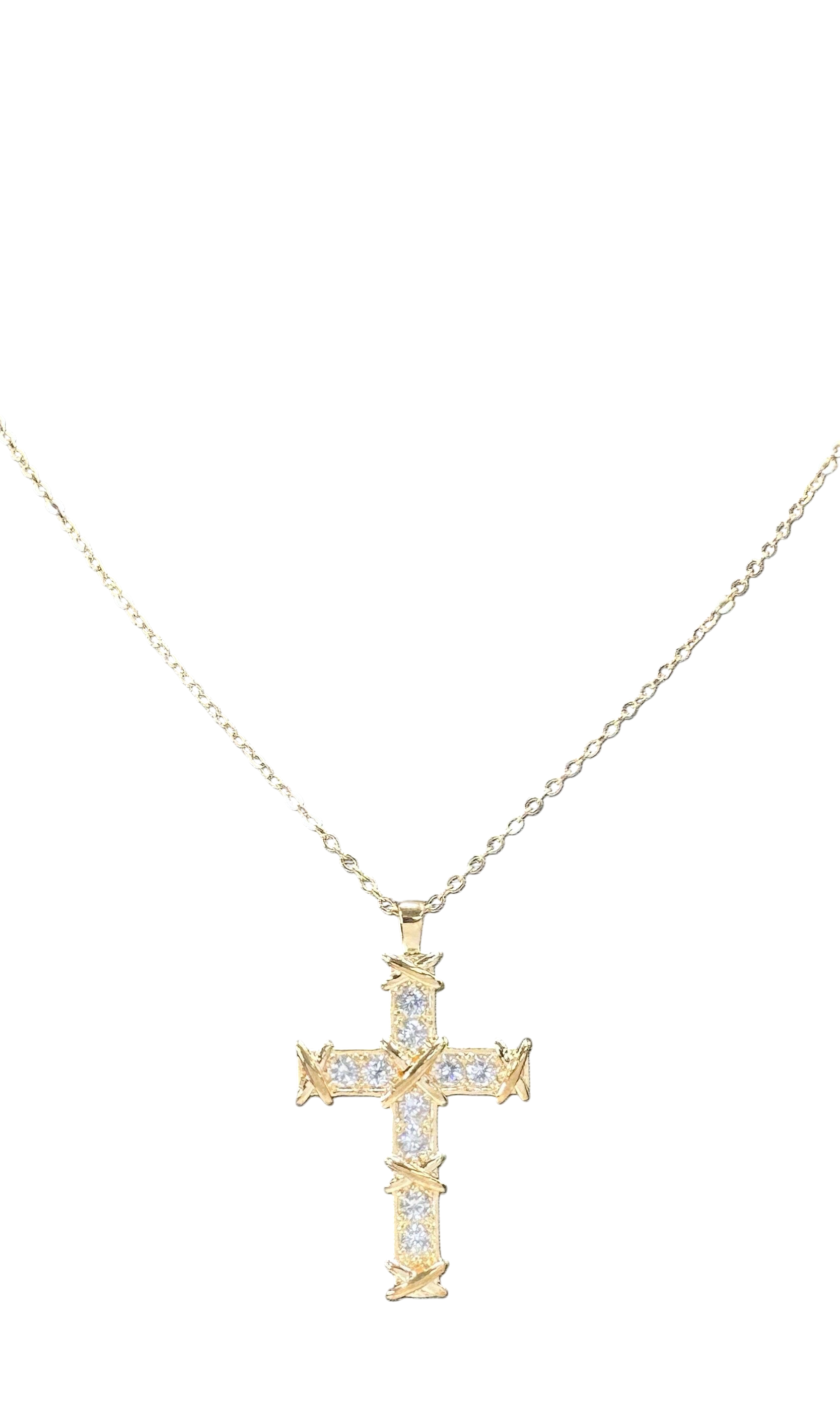 Gold cross necklace with diamonds on a white background