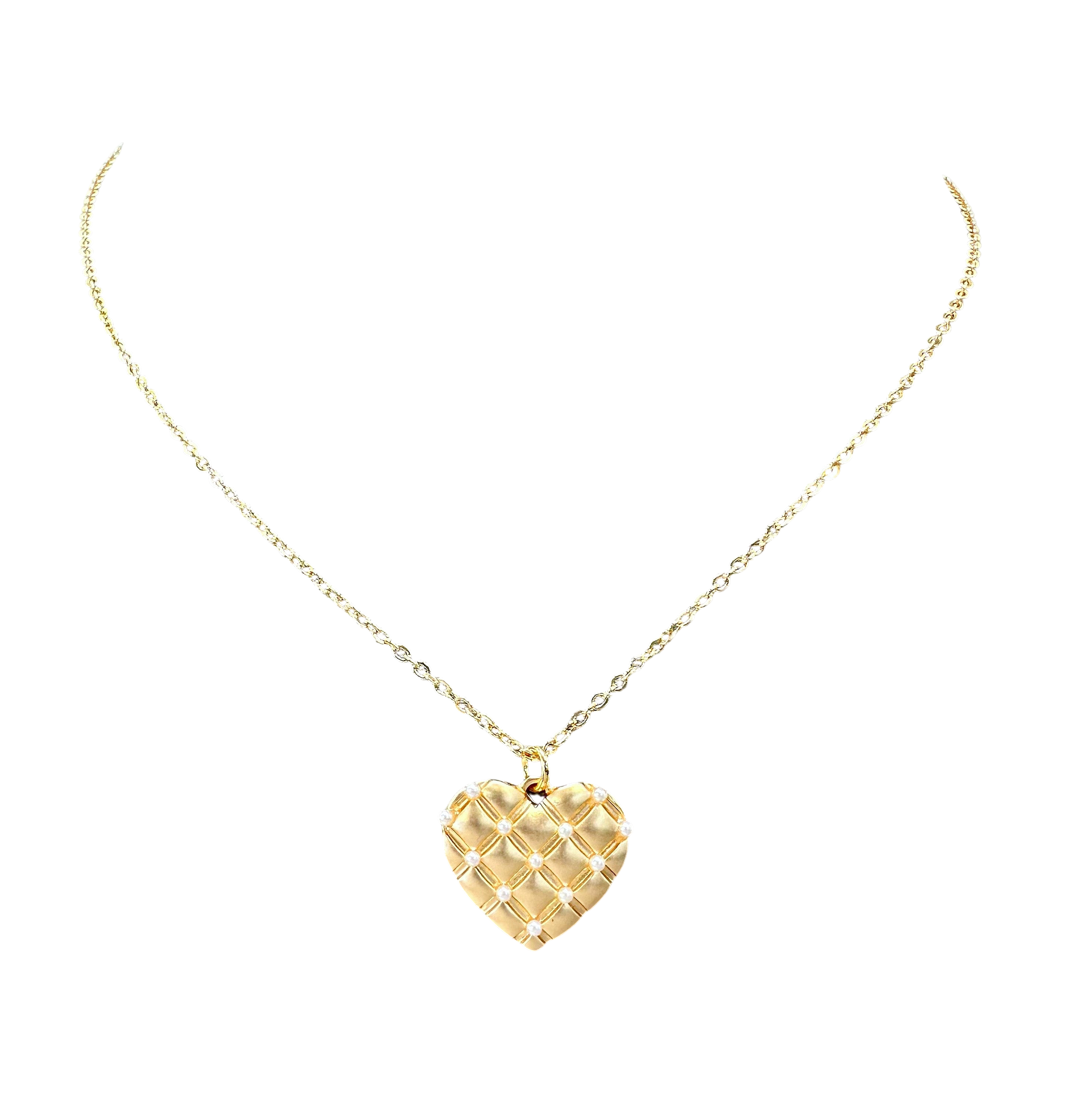 Gold heart-shaped pendant necklace on a white background