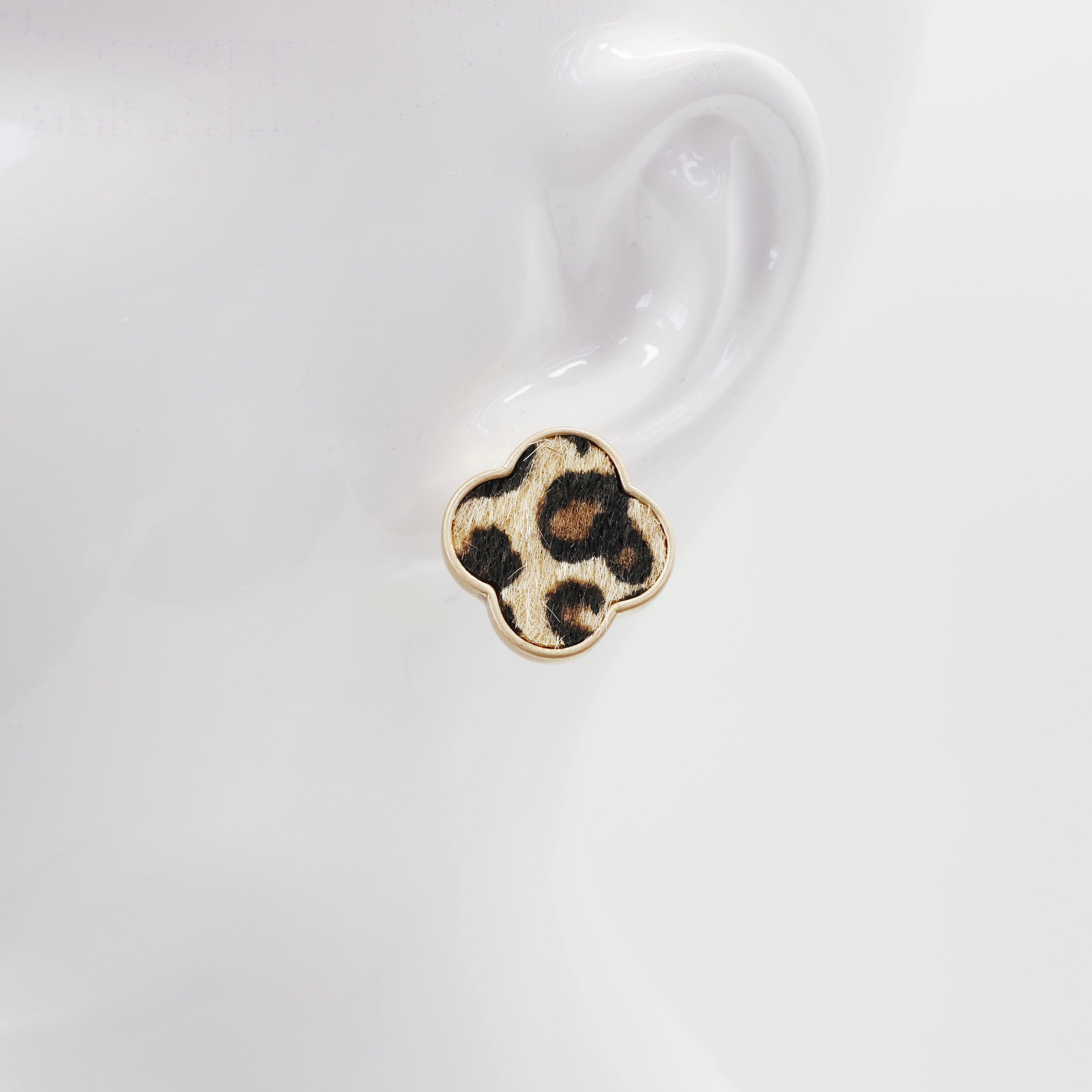 A collection of vintage style earrings with various patterns including floral, geometric, and animal prints.