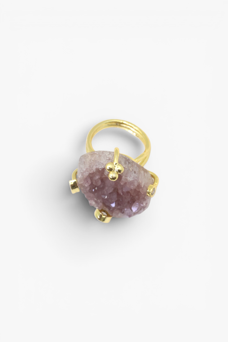 Raw natural stone statement ring with gold-tone band and organic handcrafted design.