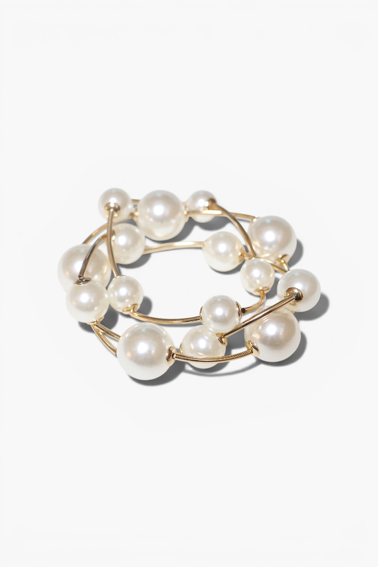 Stack of pearl rings on a white background