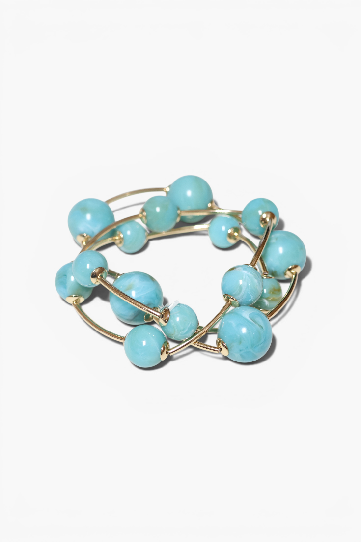 Turquoise beaded bracelet on a white background