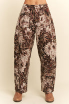 Floral patterned pants on a plain background