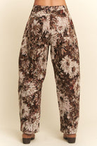 Floral patterned pants on a beige background