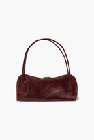 Brown leather handbag on a white background