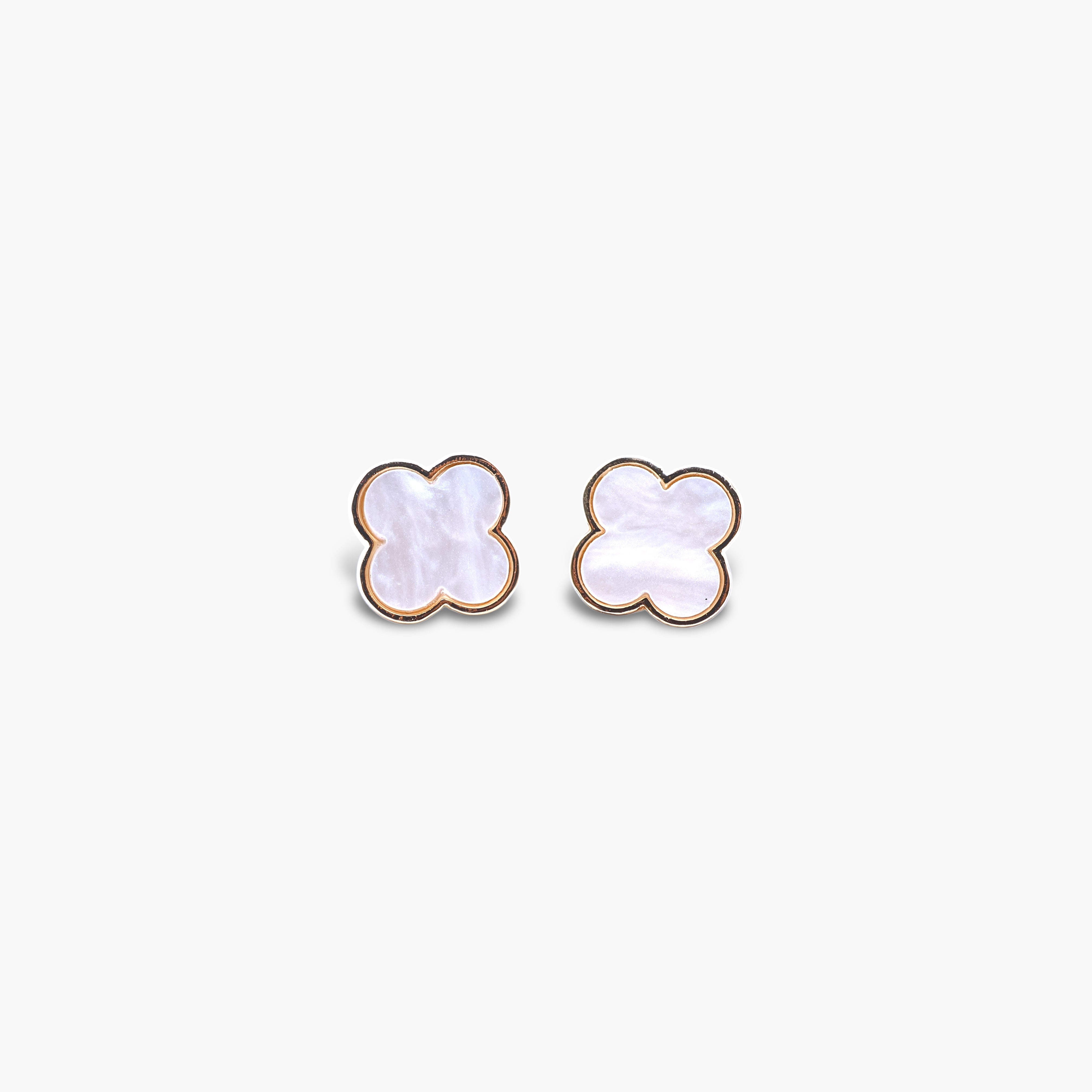 A pair of black stud earrings shaped like clovers.