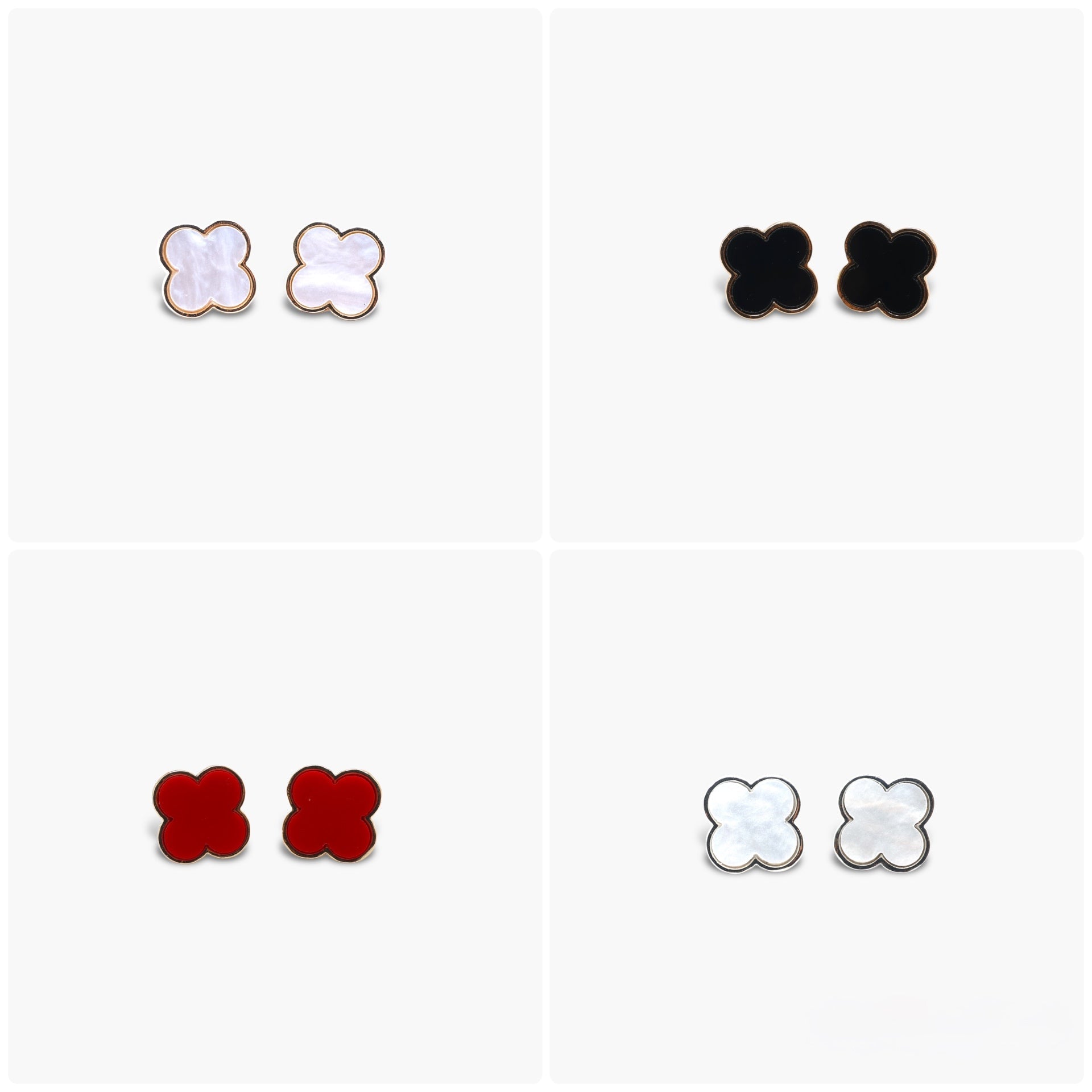 A set of four stud earrings, three with a white and black color scheme and one with a red and black color scheme.