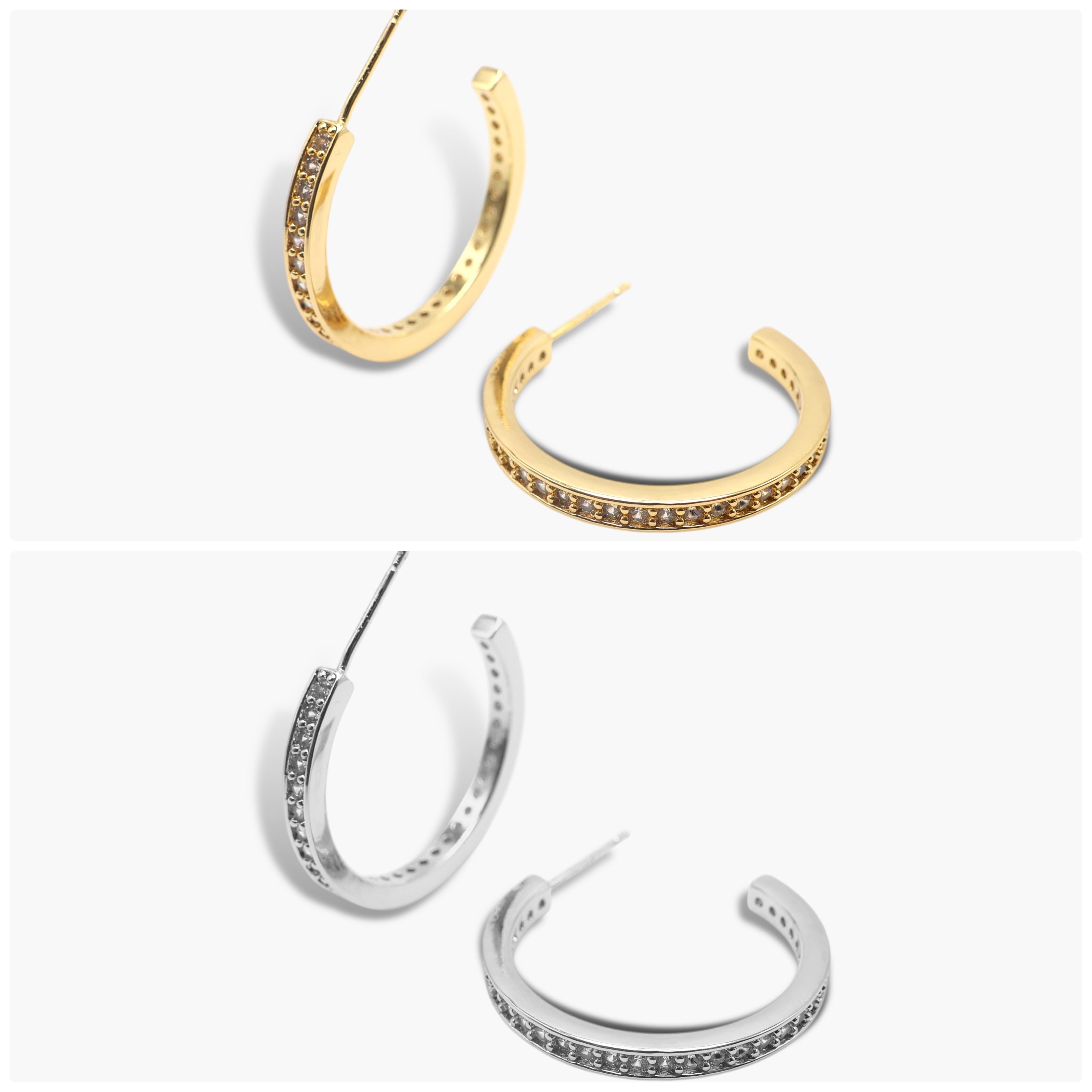 A pair of gold-colored hoop earrings with open hoops and adorned with small diamonds, displayed against a white background. The earrings are shown in two different orientations.