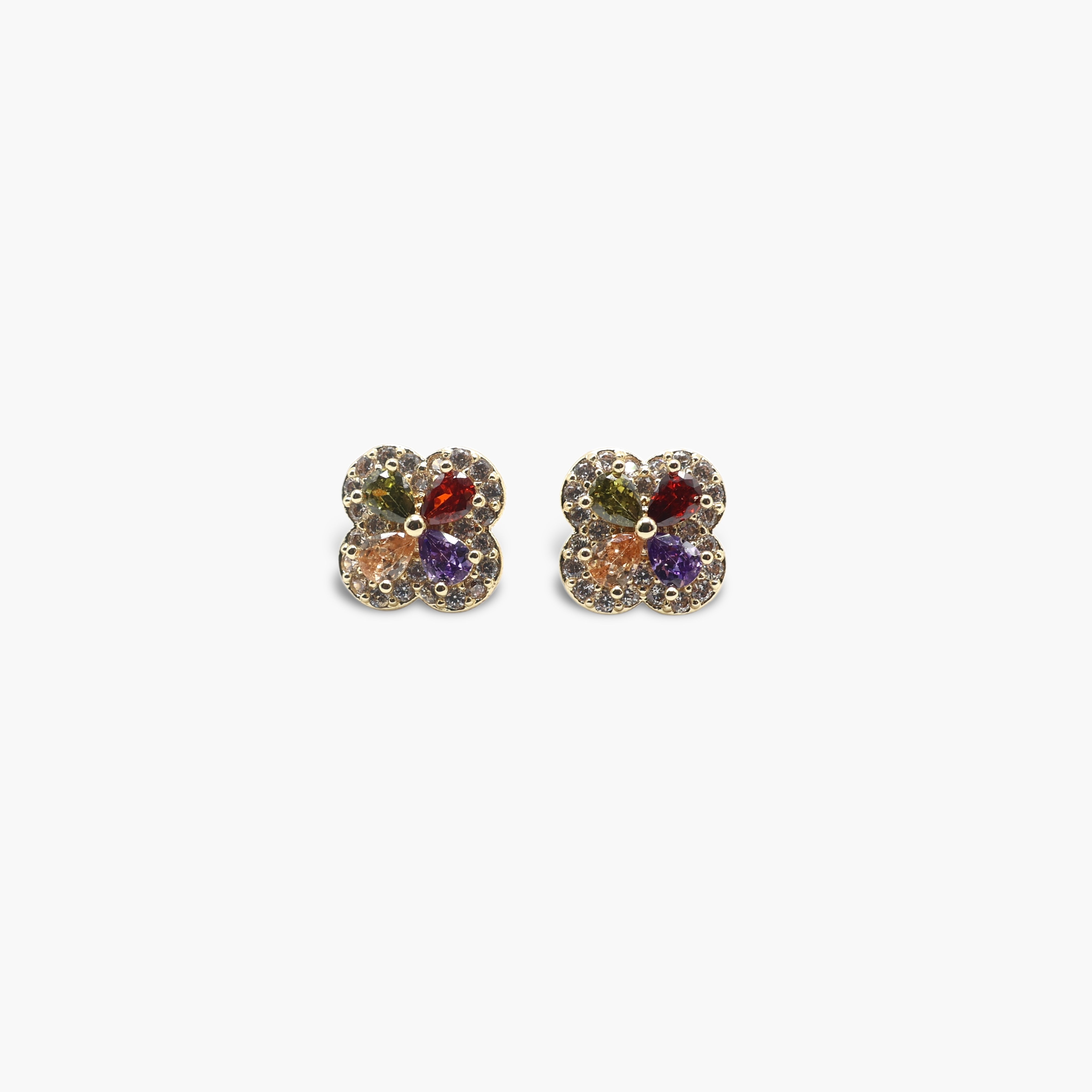 A pair of gold-colored multi-colored cubic zirconia clover earrings on a white background.