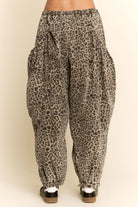 Leopard print pants on a beige background