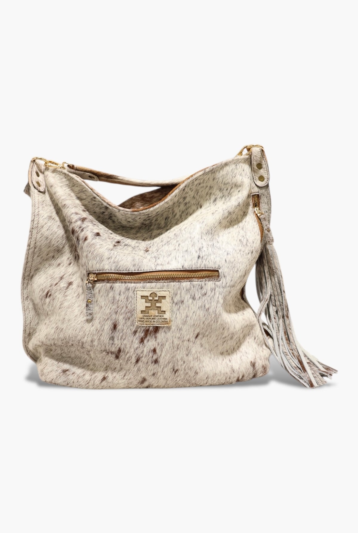 Beige leather handbag with tassel on a white background