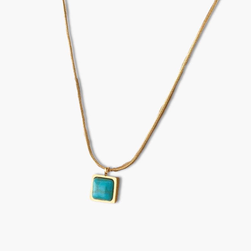 A square-shaped necklace with a blue pendant on a gold-tone chain.