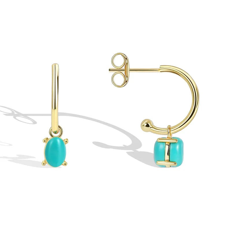 A pair of gold-colored mini hoop earrings with turquoise stones and small gold accents.