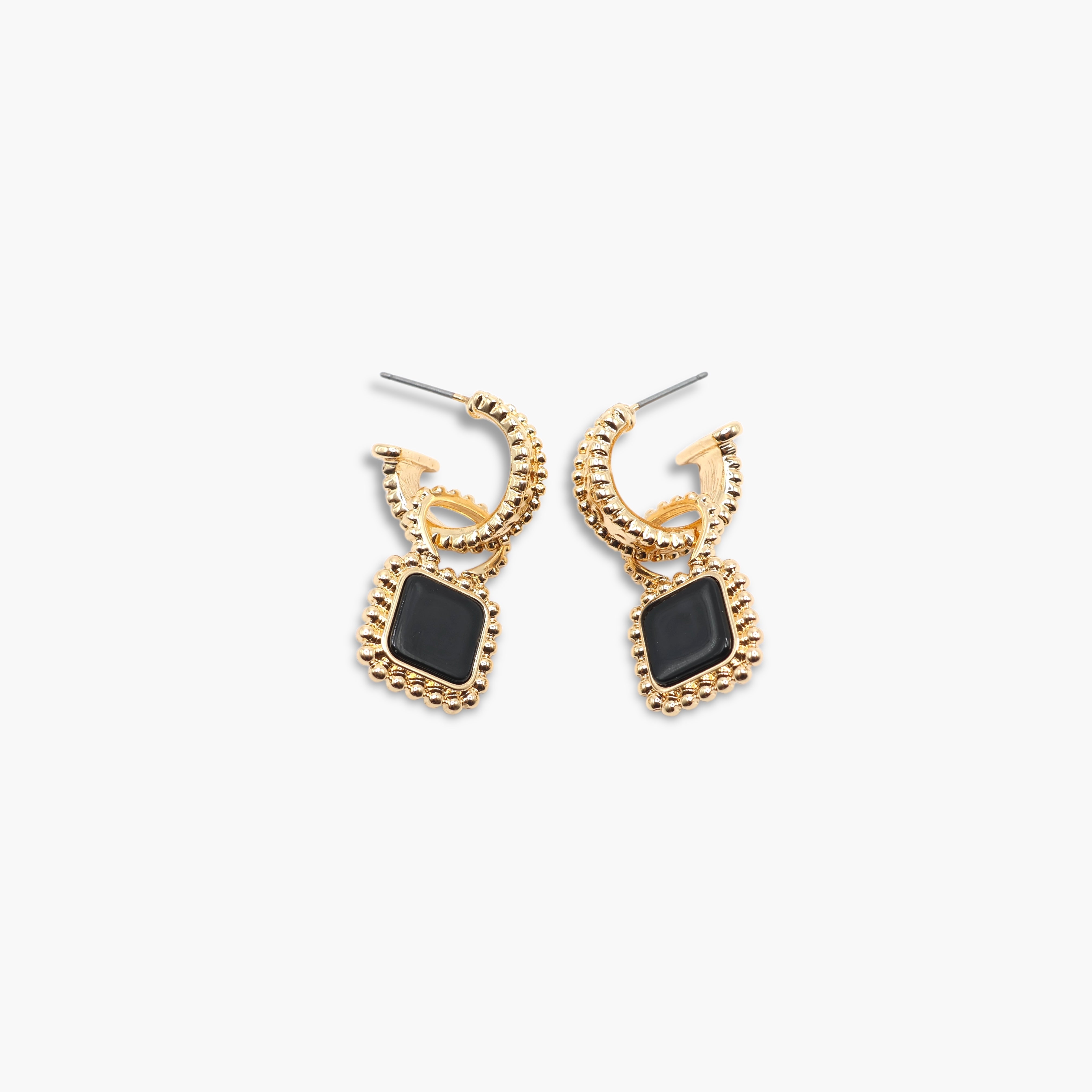 A pair of gold-colored hoop earrings with square-shaped gemstones attached to the hoops.