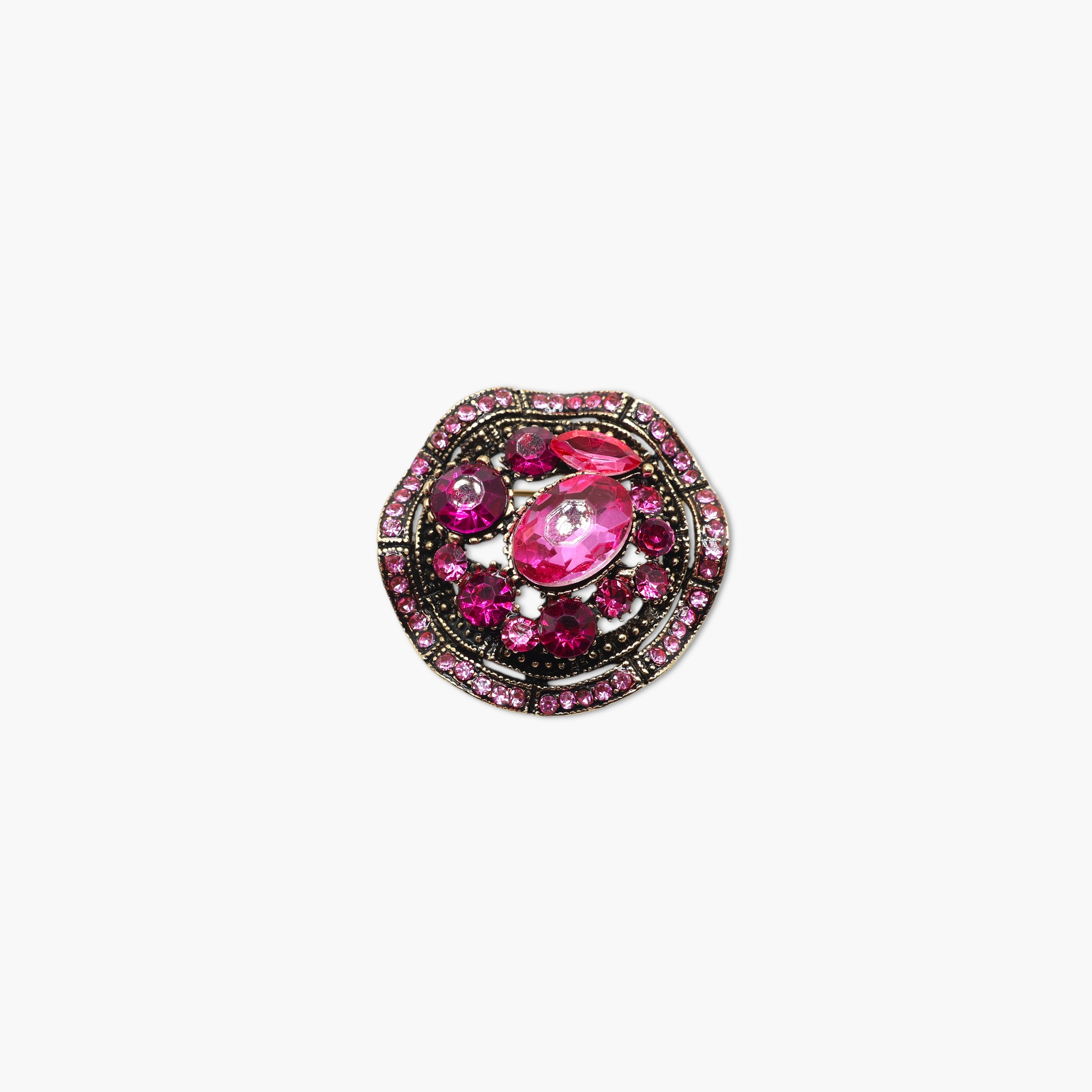 Pink gemstone brooch with black metal setting on a white background