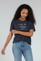 Woman wearing a gray t-shirt with 'I Love My Momma' text on a plain background