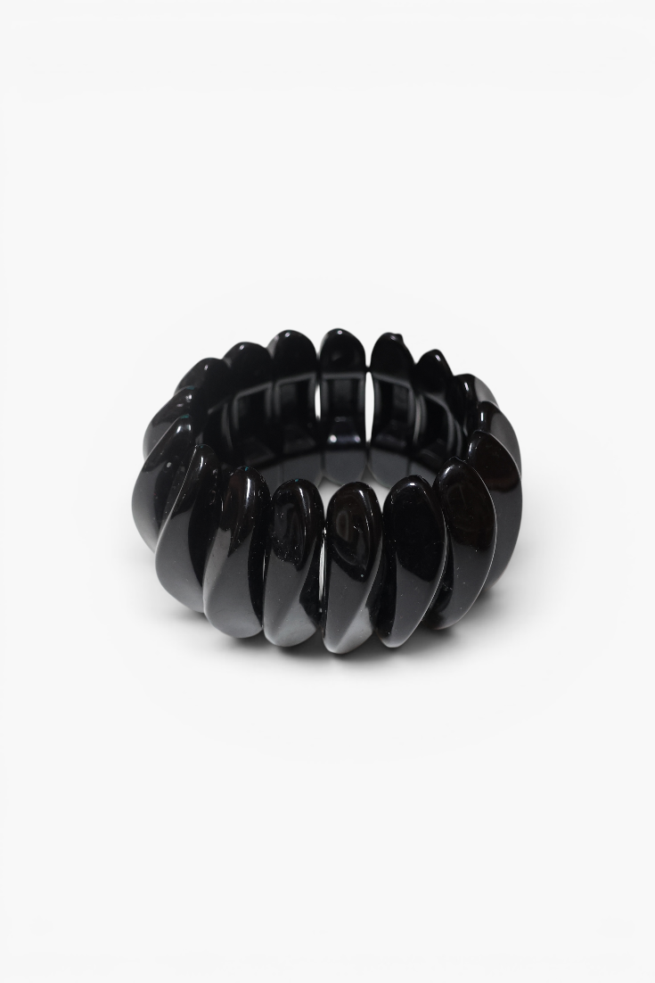 Chunky black resin stretch bracelet with glossy oval links in a sleek statement design.