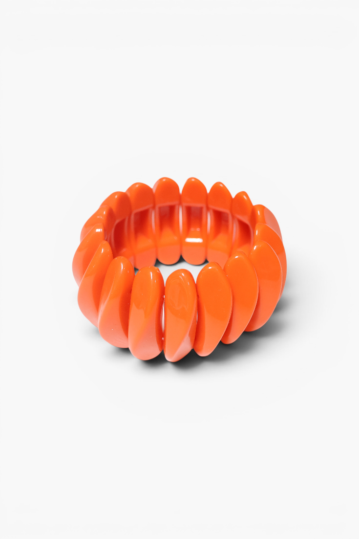 Chunky orange resin stretch bracelet with glossy oval links in a bold statement design.