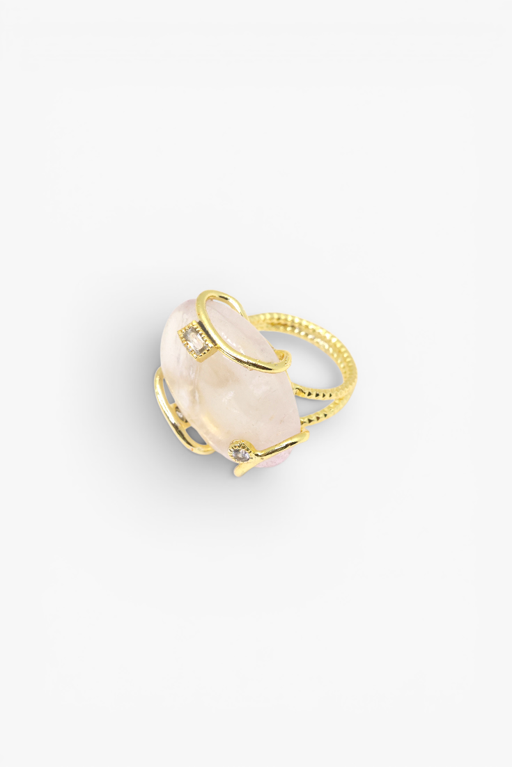 Natural stone statement ring with crystal accents in a gold-tone setting featuring an organic gemstone centerpiece.