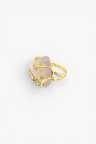 Natural stone statement ring with crystal accents in a gold-tone setting featuring an organic gemstone centerpiece.