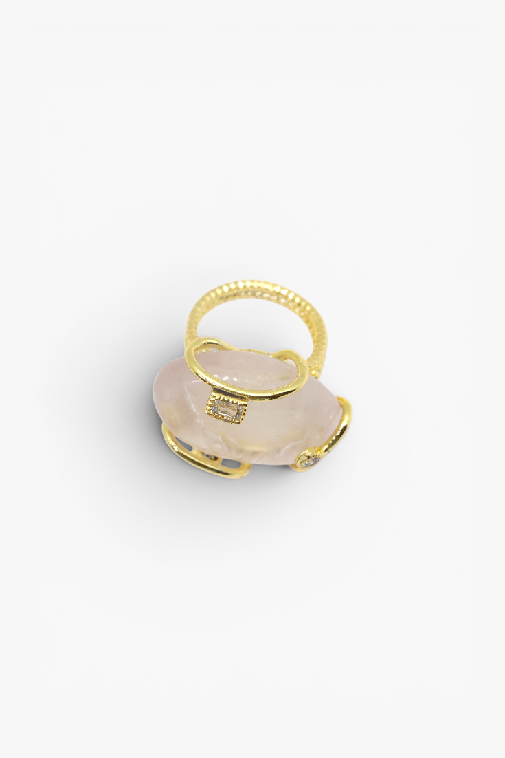 Natural stone statement ring with crystal accents in a gold-tone setting featuring an organic gemstone centerpiece.