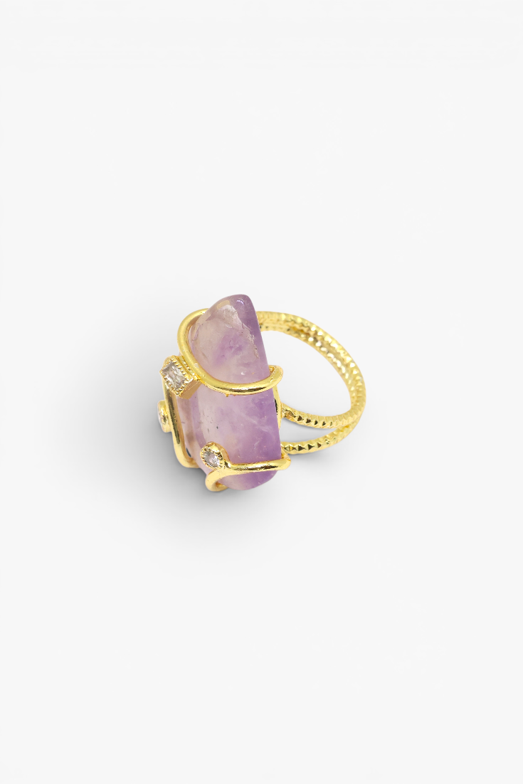 Natural stone statement ring with crystal accents in a gold-tone setting featuring an organic gemstone centerpiece.
