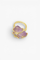 Natural stone statement ring with crystal accents in a gold-tone setting featuring an organic gemstone centerpiece.