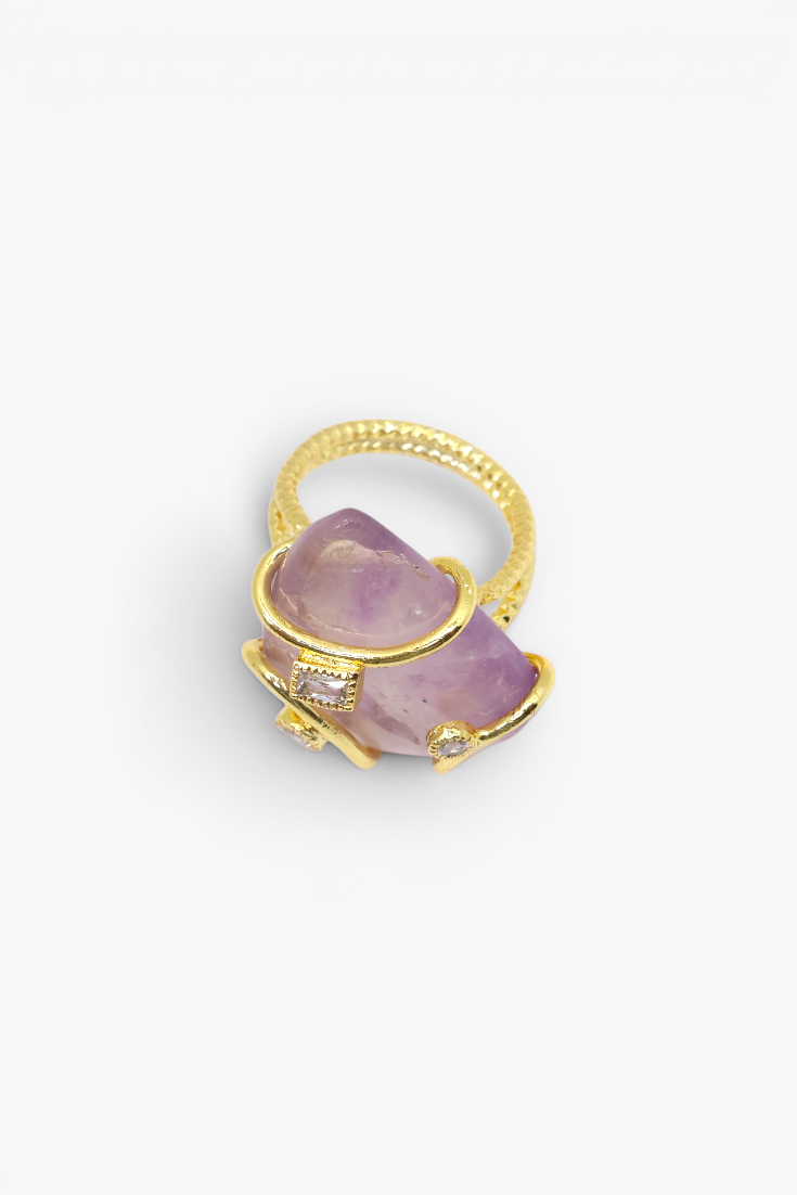 Natural stone statement ring with crystal accents in a gold-tone setting featuring an organic gemstone centerpiece.
