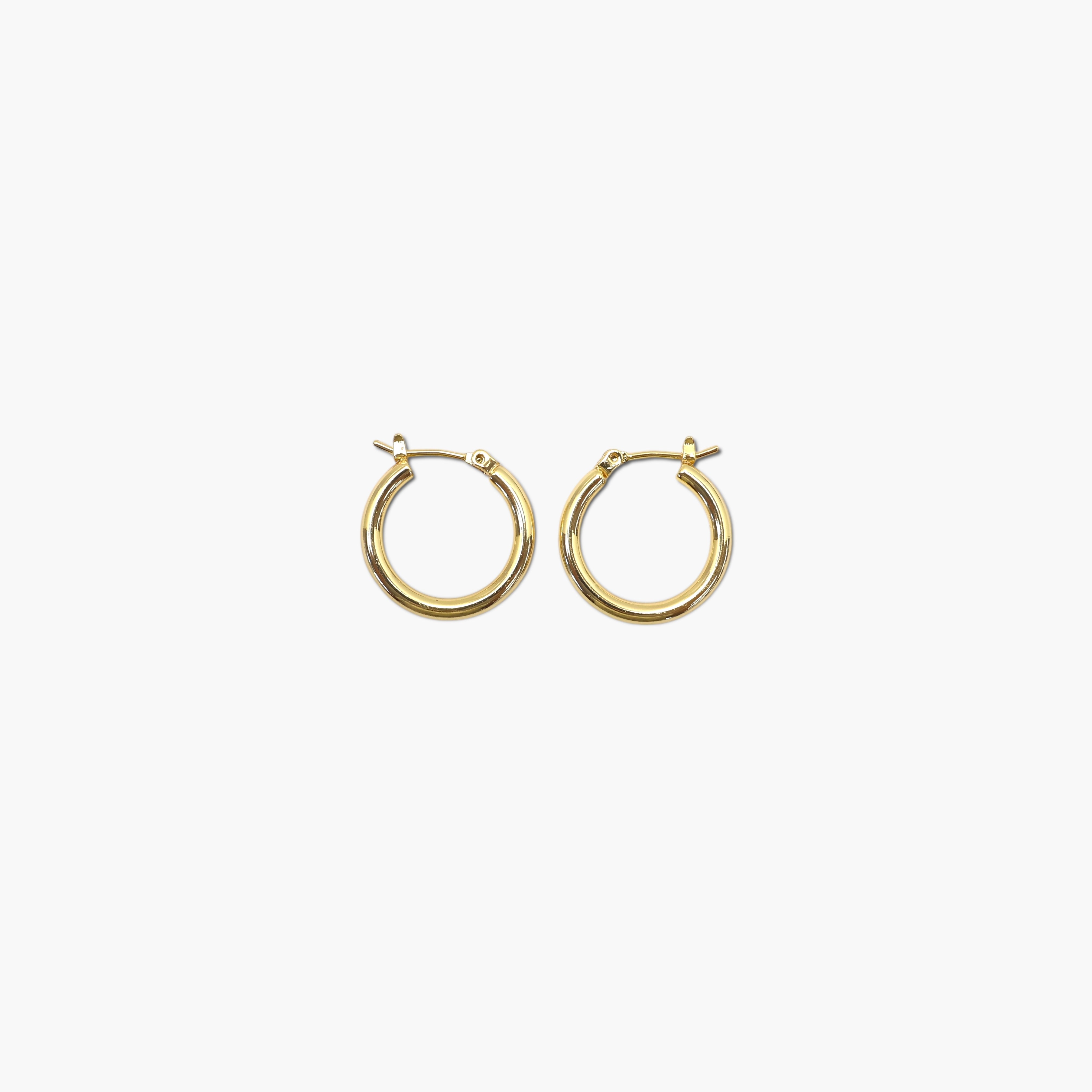 A pair of gold-colored round hoop earrings with a small metallic loop at the top.