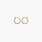A pair of gold-colored round hoop earrings with a small metallic loop at the top.