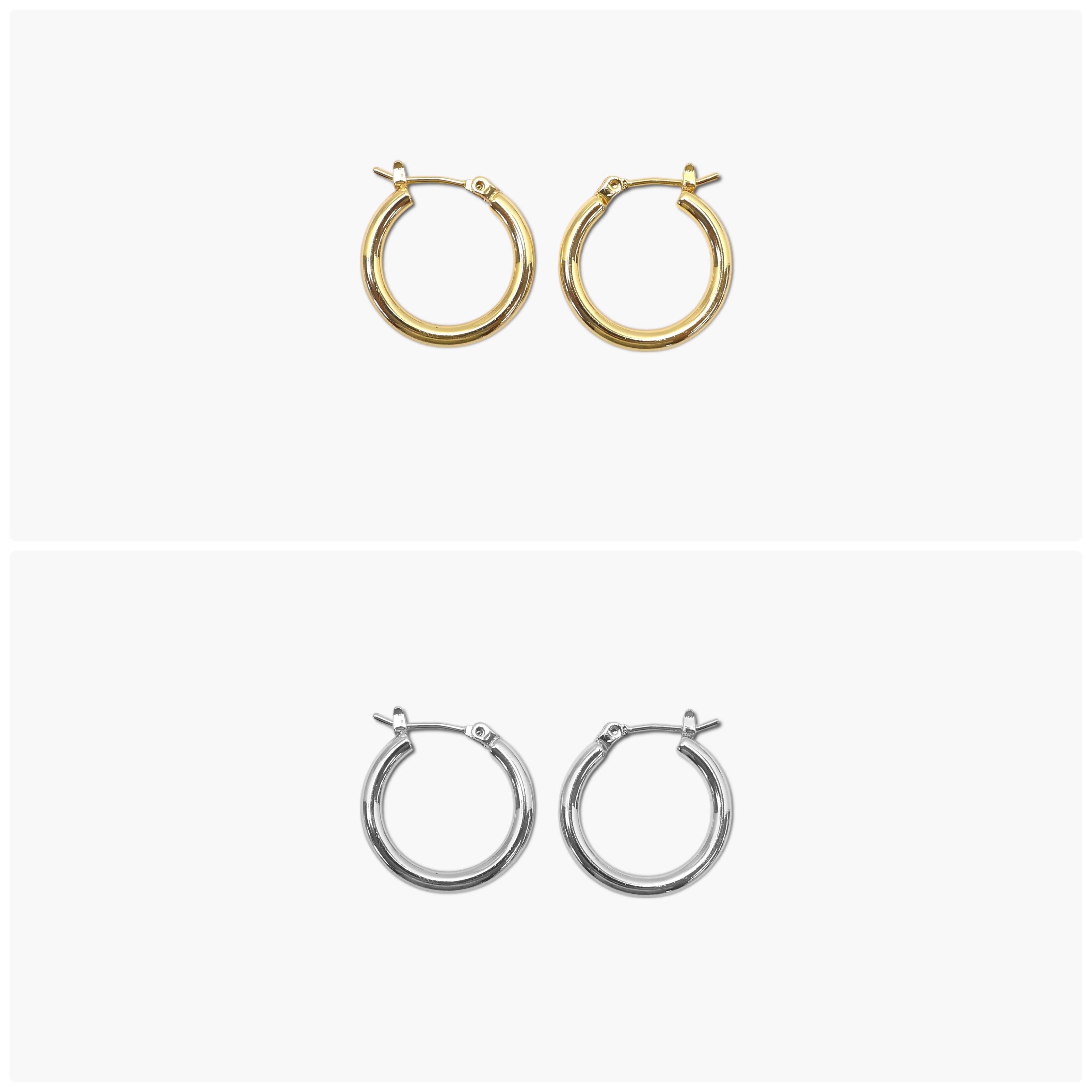 A pair of gold-colored round hoop earrings with a small metallic loop at the top.